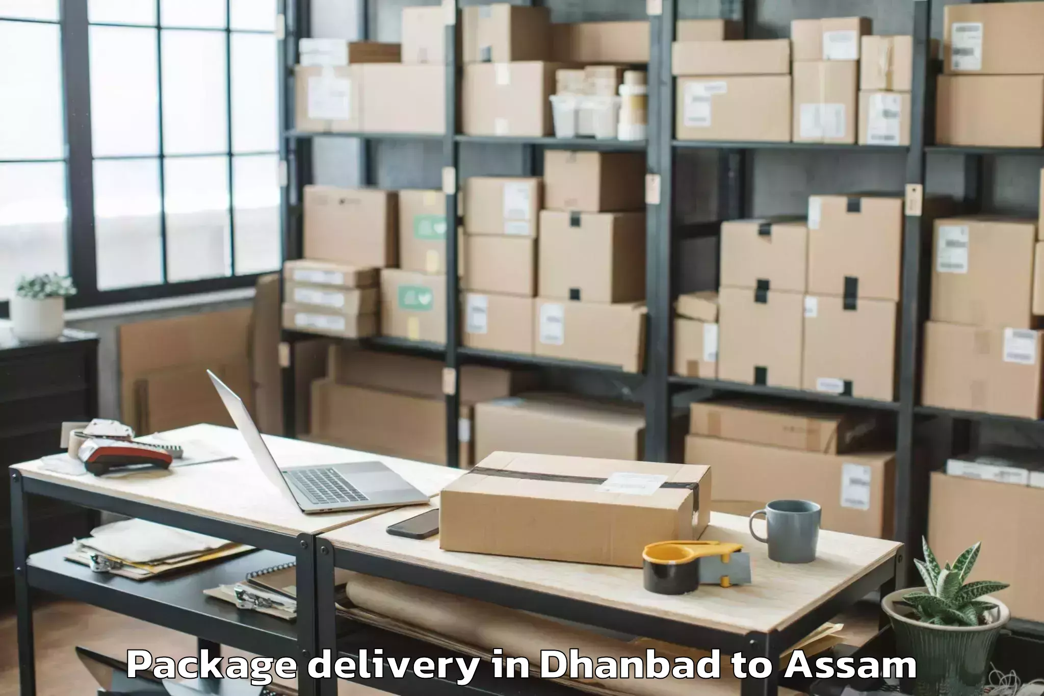 Quality Dhanbad to Gossaigaon Package Delivery